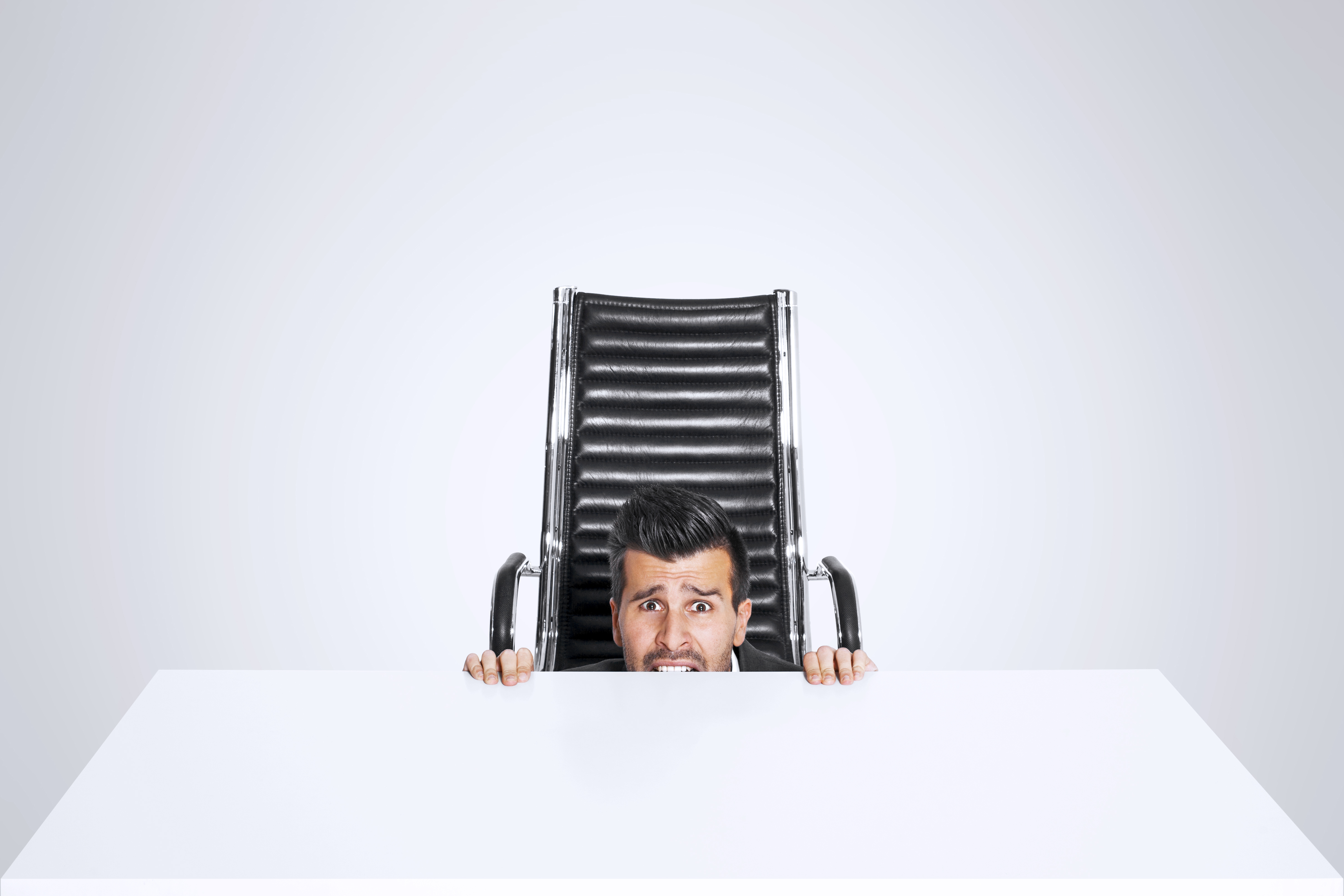 Scared Business Man Hide Himself Under The Office Desk Foment